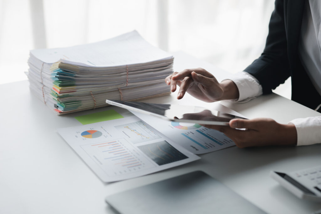 Financial accountants are checking documents from the finance department.